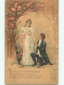 foreign 1902 Postcard GERMAN MAN DOWN ON KNEE BESIDE WOMAN AC2556