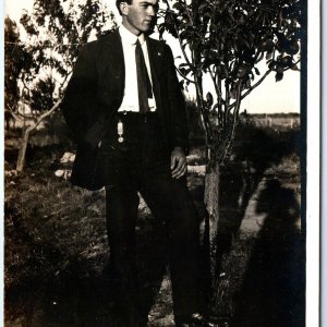 ID'd c1910s Outdoors Young Man RPPC Stand Serious Postcard Ray Stafford A162