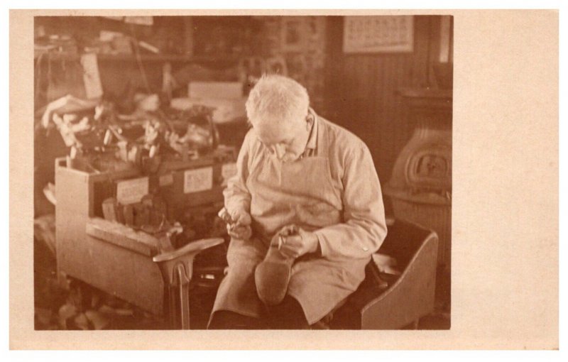 Shoemaker making shoes by hand