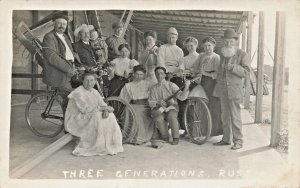 THREE GENERATIONS RUSSIANS-SOME BICYCLES & MUSIC INSTRUMENTS~1910s RPPC POSTCARD