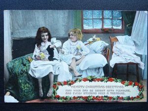 Hearty Christmas Greetings CHILDREN OPEN STOCKING PRESENTS c1912 Postcard W & K