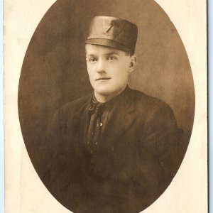 c1910s Johnstown, PA Man Military Hat Cap? RPPC Real Photo Red Front Studio A141