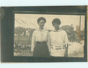 pre-1918 rppc - WHITE HORSE EATS AT TROUGH BEHIND WOMEN - postcard v1475