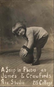 Photography Studio Advertising FOOTBALL Little Boy c1910 Real Photo Postcard