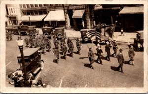 Real Photo Postcard Military Men Sailors Marching in Parade American Flag Street