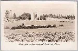 1958 Peace Arch International Border Blaine WA White Rock BC RPPC Postcard H82