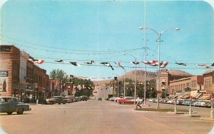 Thermopolis Wyoming Broadway Business District autos Sanborn Postcard 21-12493
