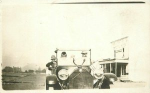 C-1910 Young men early automobile antlers flag RPPC Photo Postcard 21-9161