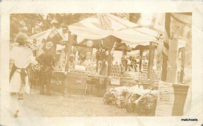 1920s Outdoor Sales Food Booth Bicycle Flags Canned Goods RPPC Real photo 2931