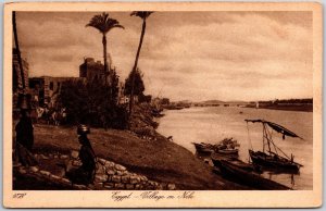 Egypt - Village On Nile Small Boats Palms Bridge in Distance Postcard