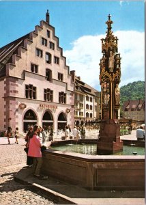 Postcard Germany Freiburg -  Münsterplatz - Kornhaus and fountain