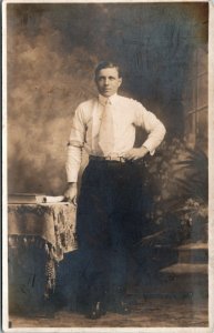 Postcard Canada RPPC Real Photo Studio Man Standing by Table White Belt 1910s K5