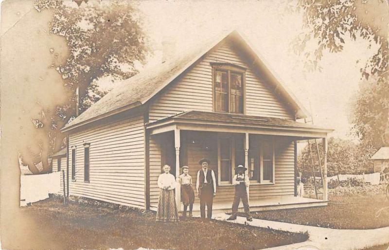 Logan Iowa view of family outside their home real photo pc Y12043