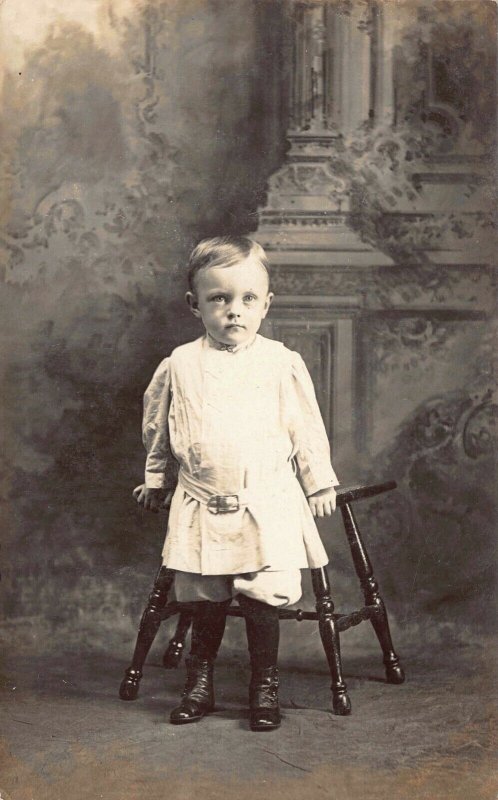 Real Photo Postcard Little Boy Toddler Leaning on Chair in a Photo Studio~127889