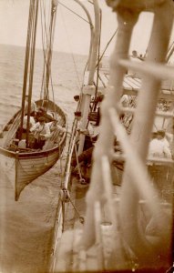 Manning the Life Boat Aboard Ship.  RPPC