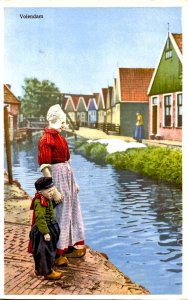 Netherlands - Volendam. Woman & Child at Canal