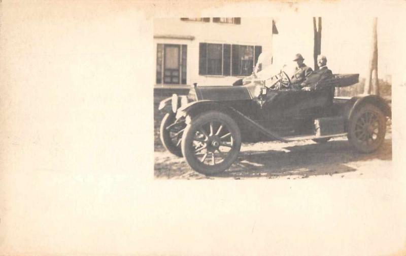 View of two older men sitting in early model automobile real photo pc Z42031