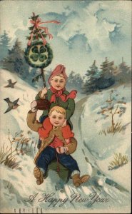 PFB New Year 11090 Children Boy and Girl Sledding c1910 Vintage Postcard