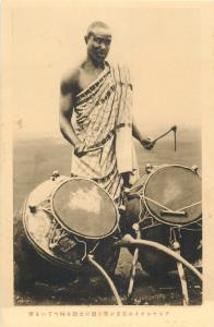 Ashanti Prince holding the drum made in that region Ghana Gold Coast West Africa