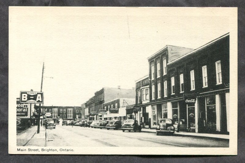 dc457 - BRIGHTON Ontario 1940s Main Street. Stores. Cars. B-A Service Sign