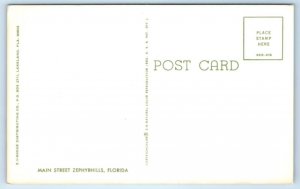 ZEPHYRHILLS, FL Florida ~ STREET SCENE c1960s Cars VW ~Elsie's 5 & 10  Postcard