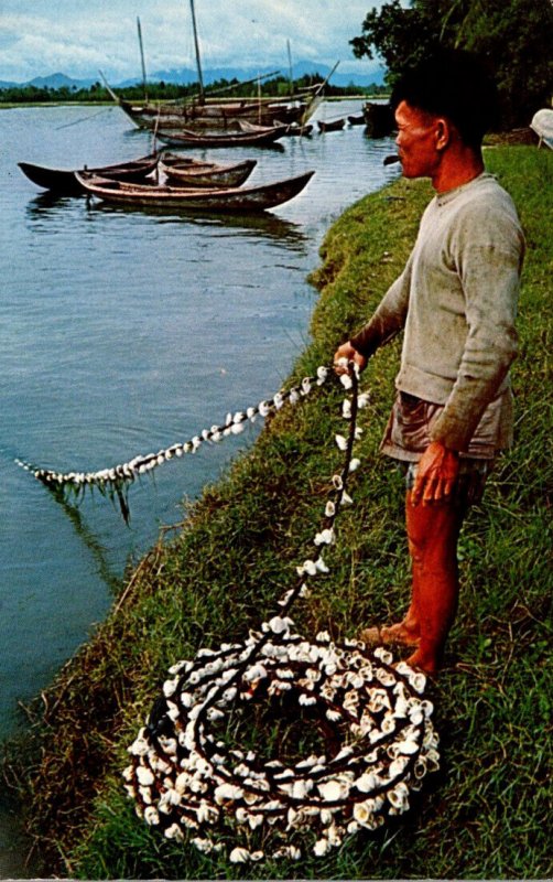 South Viet Nam Fisherman Near Quang Ngai Pulling In His Nets