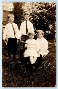 RPPC Mystery c1910s Postcard : 4 Cute Dressed Up RICH KIDS & Their SCOOTER TOY