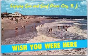 VINTAGE POSTCARD ENJOYING SUN AND SURF AT OCEAN CITY N.J. MAILED 1964