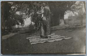 AMERICAN INDIAN WOMAN ARCHERY LESSON ANTIQUE REAL PHOTO POSTCARD RPPC
