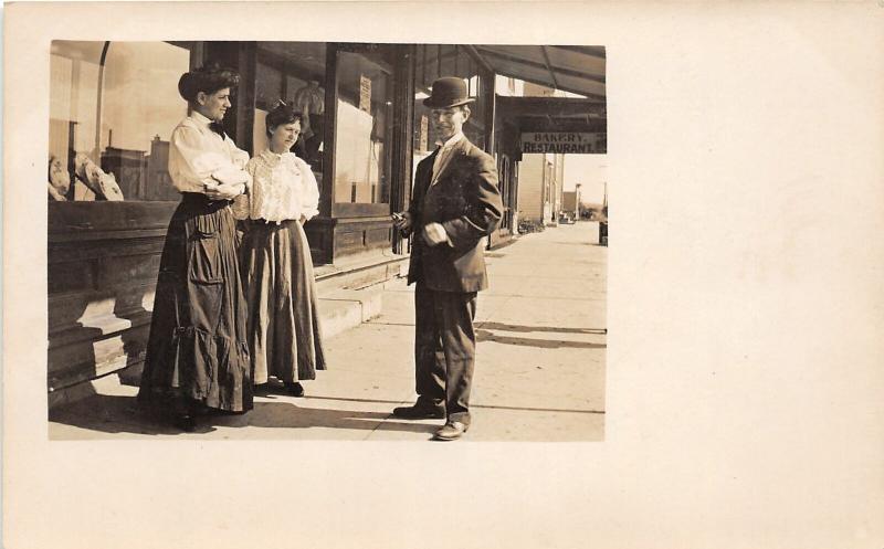 F36/ Newcastle Wyoming Postcard RPPC c1910 Store Man Top Hat Women