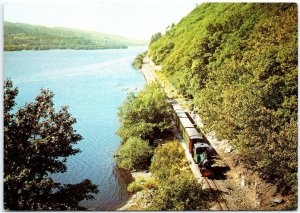 VINTAGE POSTCARD CONTINENTAL SIZE TRAIN RUNNING THROUGH THE LLANBERIS LAKE WALES