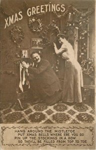 C-1910 Christmas Mistletoe romance Couple Interior Postcard 22-8320