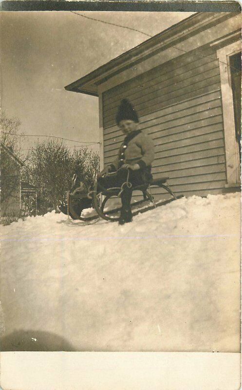 C-1910 Little Boy toy sled winter scene RPPC Photo Postcard 7839