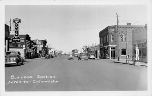 J21/ Antonito Colorado RPPC Postcard c1950s Business Section Drug Store 243
