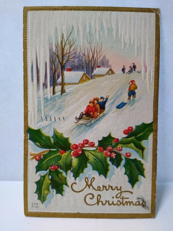 Christmas Postcard Gold Border Embossed Children On Sled Icicles Snow Nash c 35 