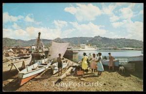 Fishing canoes and cruise ship in Castries harbour