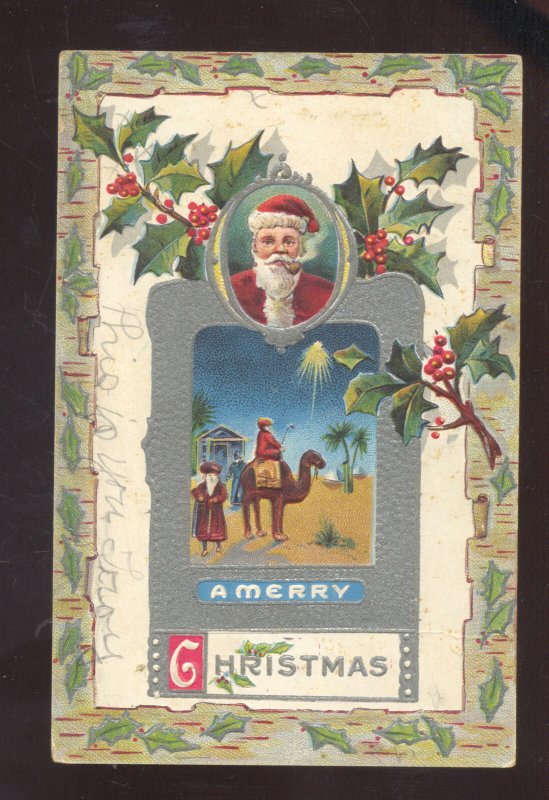 MERRY CHRISTMAS SANTA CLAUS FACE CAMEL VINTAGE CHRISTMAS POSTCARD 1909