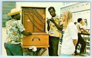 CURACAO, N.W.I. ~ ORGAN PLAYERS Welcoming Tourist Steamer on Pier Postcard