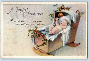 Christmas Baby On Rocking Crib Holly Berries Embossed Manasquan NJ Postcard