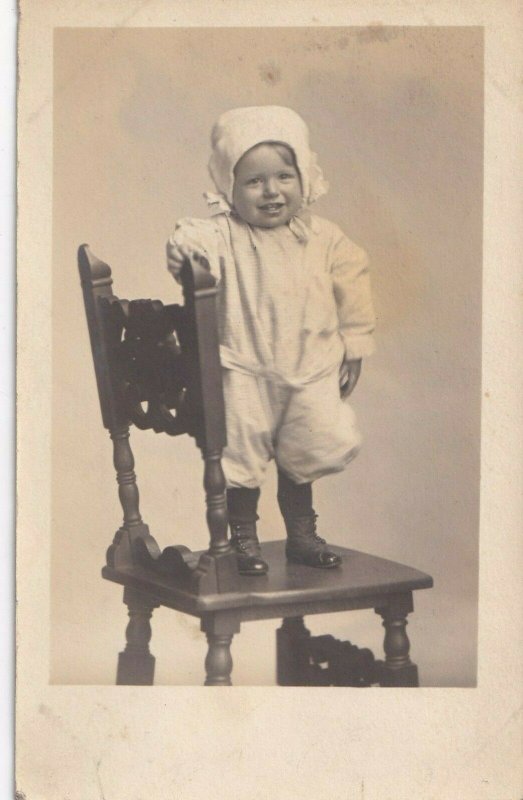 1904-1918 RPPC AZO Studio View Portrait Baby Standing On Chair