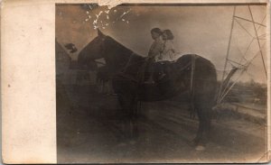 VINTAGE POSTCARD YOUNG BOY AND GIRL ON HORSEBACK RPPC (REAL PHOTO) 1918-1930