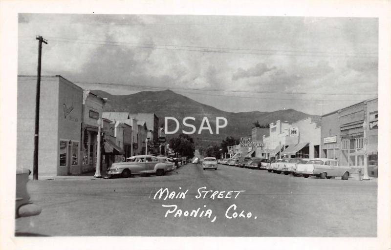 Colorado CO Postcard Real Photo RPPC c1950s PAONIA Main Street Stores Cars CAFE