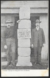 Two Men Standing Next to Powder Charge for Biggest Gun on Earth Unused c1910s