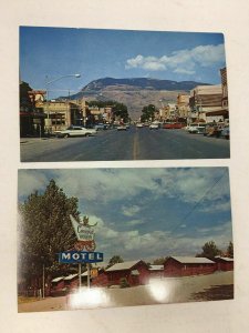 Cody WY 2 Postcards Sheridan Street Scene Covered Wagon Motel