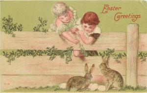 Easter Postcard Cherub Like Children Feed Bunny Rabbits