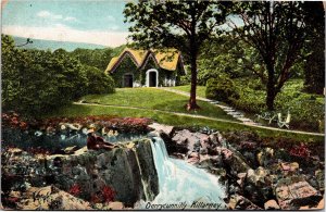 Postcard Ireland Killarney Derrycunnihy man resting by falls and cottage