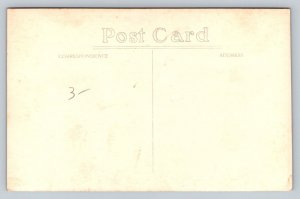 RPPC  Native Worker Harvesting Rubber Tree  c1920  Postcard