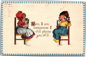 Postcard Dutch Boy Girl Ven I am lonsesome I vill phone you  1913 Waterloo IA