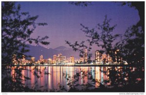 The English Bay Skyline at night reflect on the water, Grouse Mountain,  Vanc...
