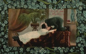 Vintage Postcard 1910s How To Kiss a Little Lazy Girl Woman Laying on Couch